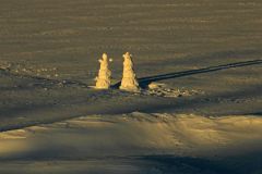 26B Snowmen On Frozen Lake Louise At Sunrise.jpg
